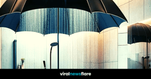 An innovative and artistic shower design where an umbrella forms the shower canopy, set in a modern bathroom with wooden accents and soft lighting for a serene ambiance.