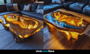 A beautifully crafted epoxy resin table with glowing wood and cat designs in a cosy living room setting.