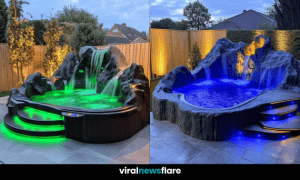 A luxurious garden hot tub illuminated with green and blue LED lighting, surrounded by artificial rock features and a modern outdoor setting.