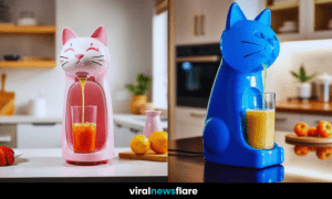 A stylish cat-shaped juicer dispensing fresh juice into a glass on a modern kitchen countertop.