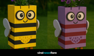 Colourful bee-themed wooden flower planters with petunias on green lawn