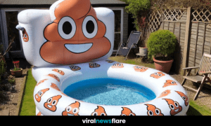 A unique inflatable pool with a poo emoji design, set up in a backyard garden with sunny weather.