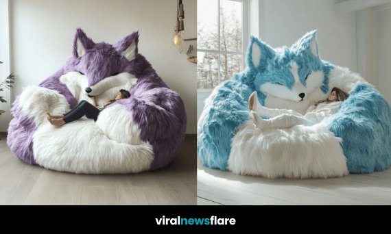A giant plush fox chair in blue and white, cradling a relaxed person in a sunlit room.