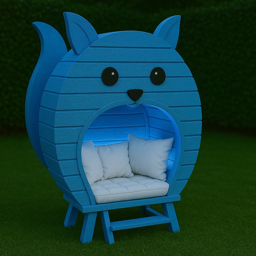 Cat-shaped garden lounger in blue with white cushions and soft blue LED lights on grass
