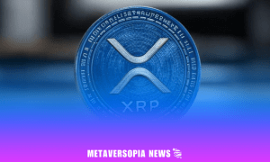 Close-up of XRP cryptocurrency coin with Metaversopia News branding on a blue and purple gradient background