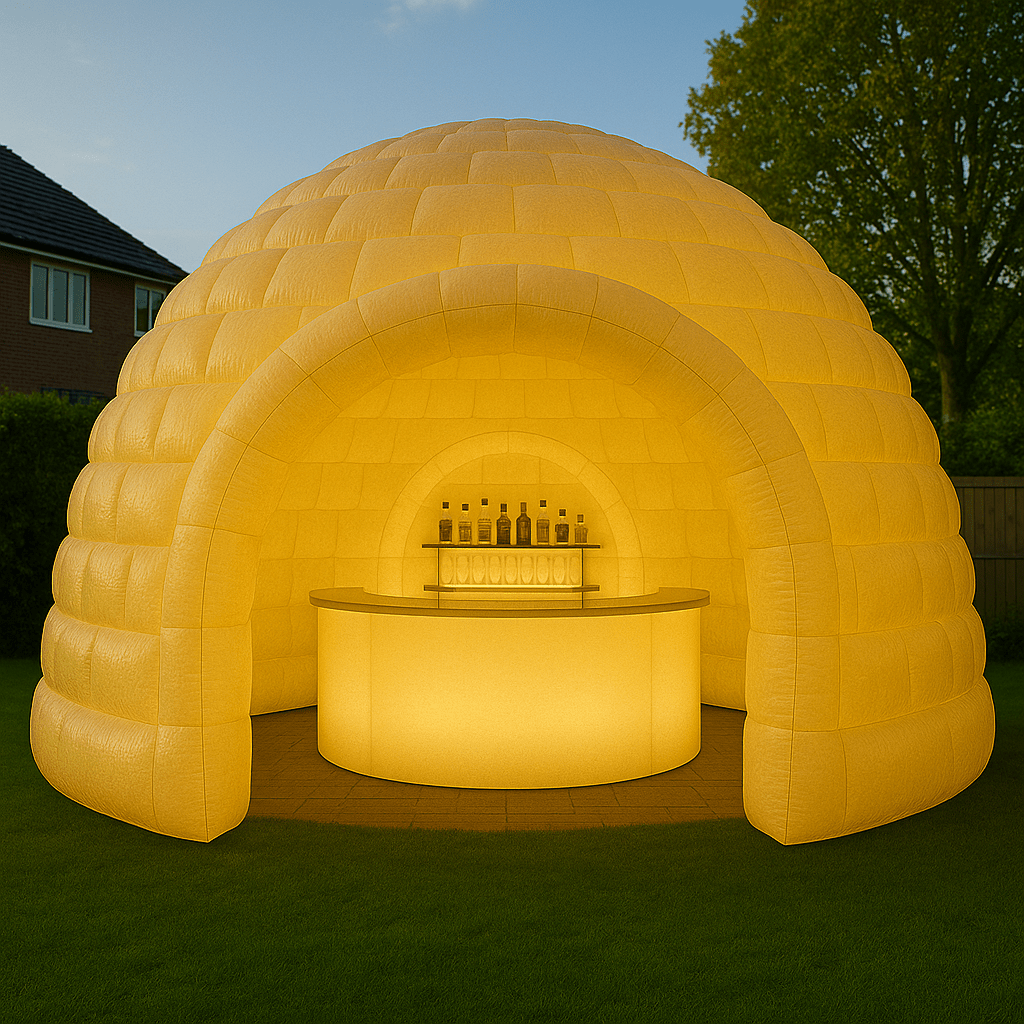 Inflatable igloo bar glowing in yellow LED lighting for outdoor parties