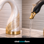Elegant swan-shaped luxury kitchen faucet with sculptural design and gold accents