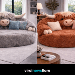 Oversized highland cow plush sofa in luxury living room setting