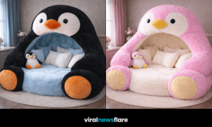 Large pink penguin lounge pod with plush interior cushions in a cosy children’s bedroom
