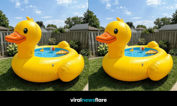 Oversized yellow duck inflatable paddling pool placed on grass in a bright summer garden setting