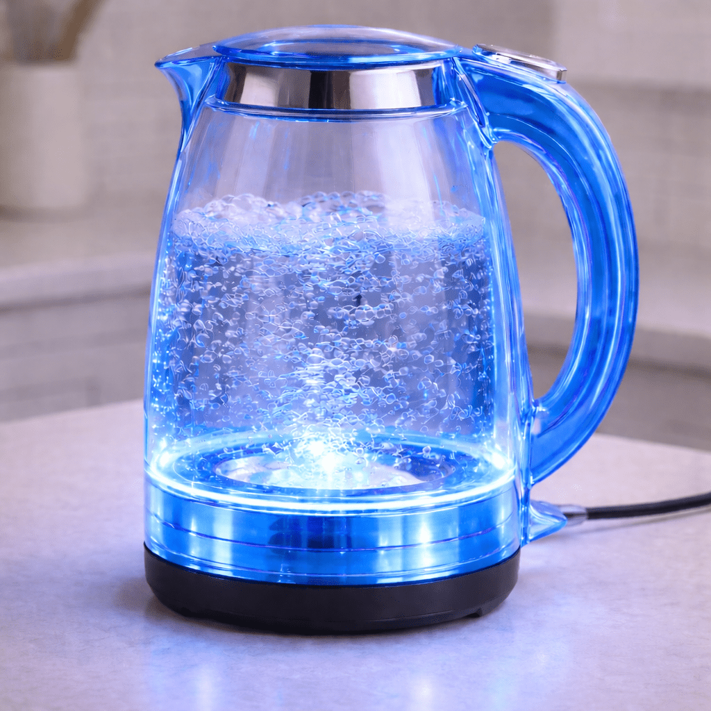 Blue LED transparent kettle illuminating boiling water in modern kitchen