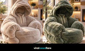 Oversized plush hoodie chair with padded sleeves, large hood and drawstrings creating a cosy statement furniture design